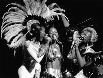 (L-R) Nona Hendryx, Sarah Dash and Patti LaBelle of Labelle on stage at Lincoln Center in New York City. October 6, 1974. © Bob Gruen / www.bobgruen.comPlease contact Bob Gruen's studio to purchase a print or license this photo. email: websitemail01@aol.com phone: 212-691-0391 